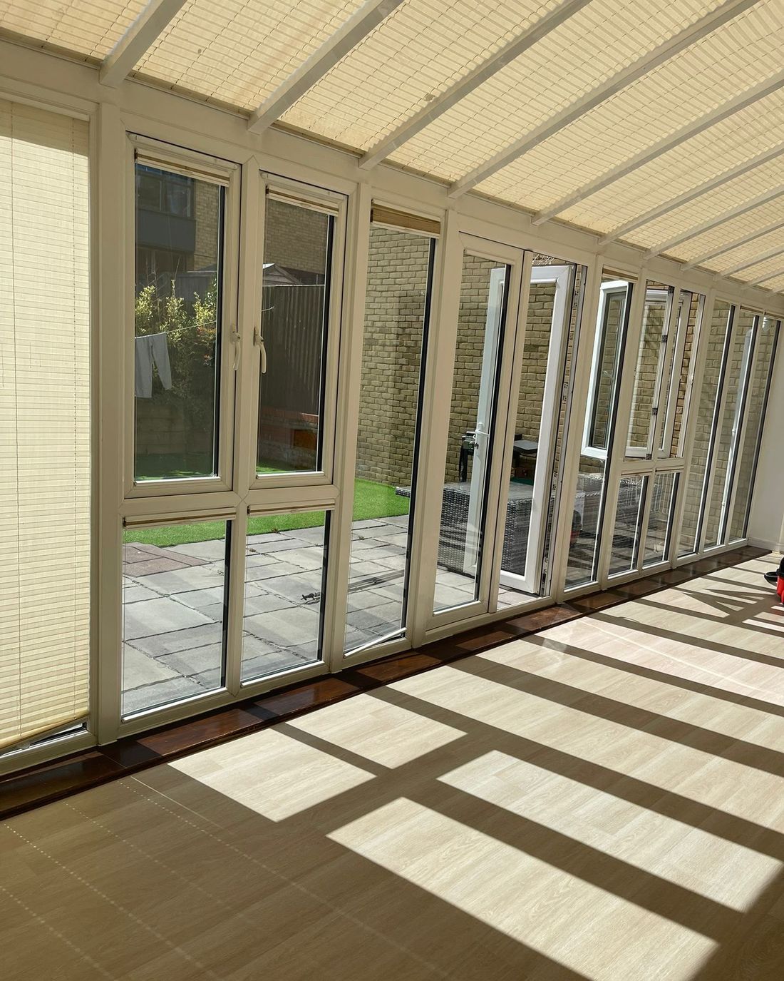 Conservatory with clean glass and a spotless floor in the sun