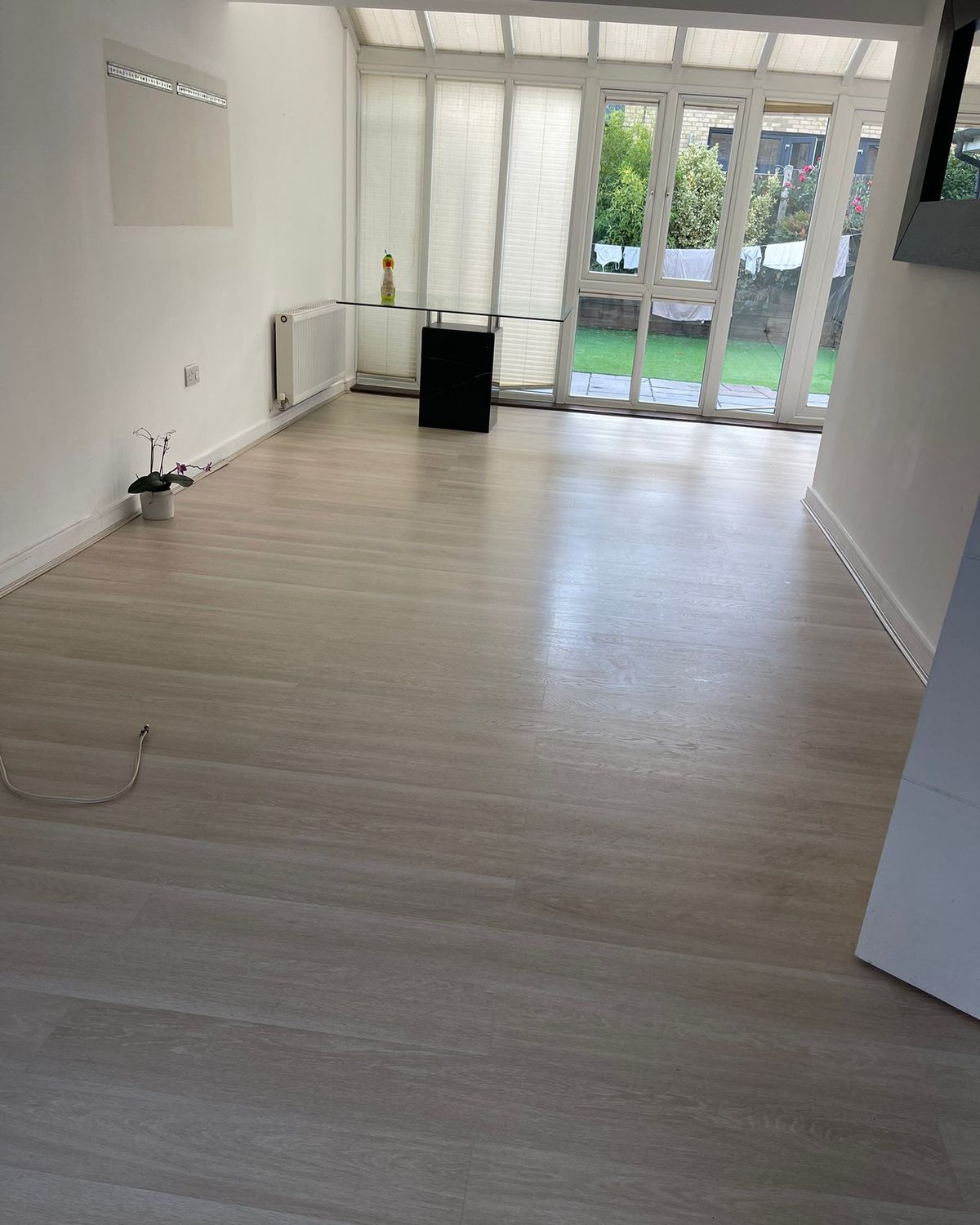 Bright living room with a spotless floor after a G&L clean